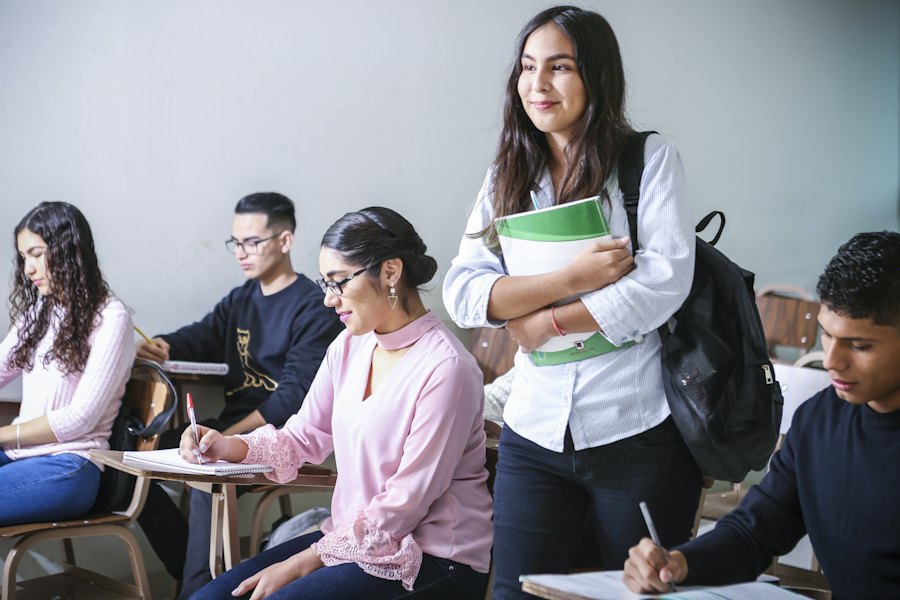 Student holding notebooks